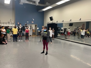 Billicia Charnelle Hines and Bryan and Shaina Baira stand with first year theatre and dance students in a dance studio